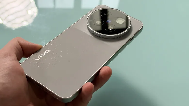 Vivo X500 Pro Max held in hand, displaying the rear of the device.